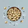 Premium photoshoot of Himalayan Salt & Black Pepper Makhana with seasoning accents