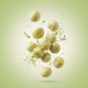 Floating wasabi makhana showing its crunchy texture and fresh green seasoning against a soft background