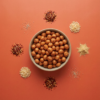 Top view of momo chutney makhana arranged neatly on a warm red background, showing its spicy chutney-style coating
