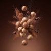 Floating chocolate makhana showing its crunchy texture and smooth chocolate coating against a soft background