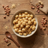 Top view of peanut butter flavoured makhana in a bowl, highlighting its golden colour and roasted texture