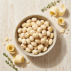Top view of white cheddar flavoured makhana in a bowl, highlighting its light colour and even seasoning